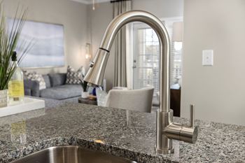 A kitchen with granite counter tops and a sink